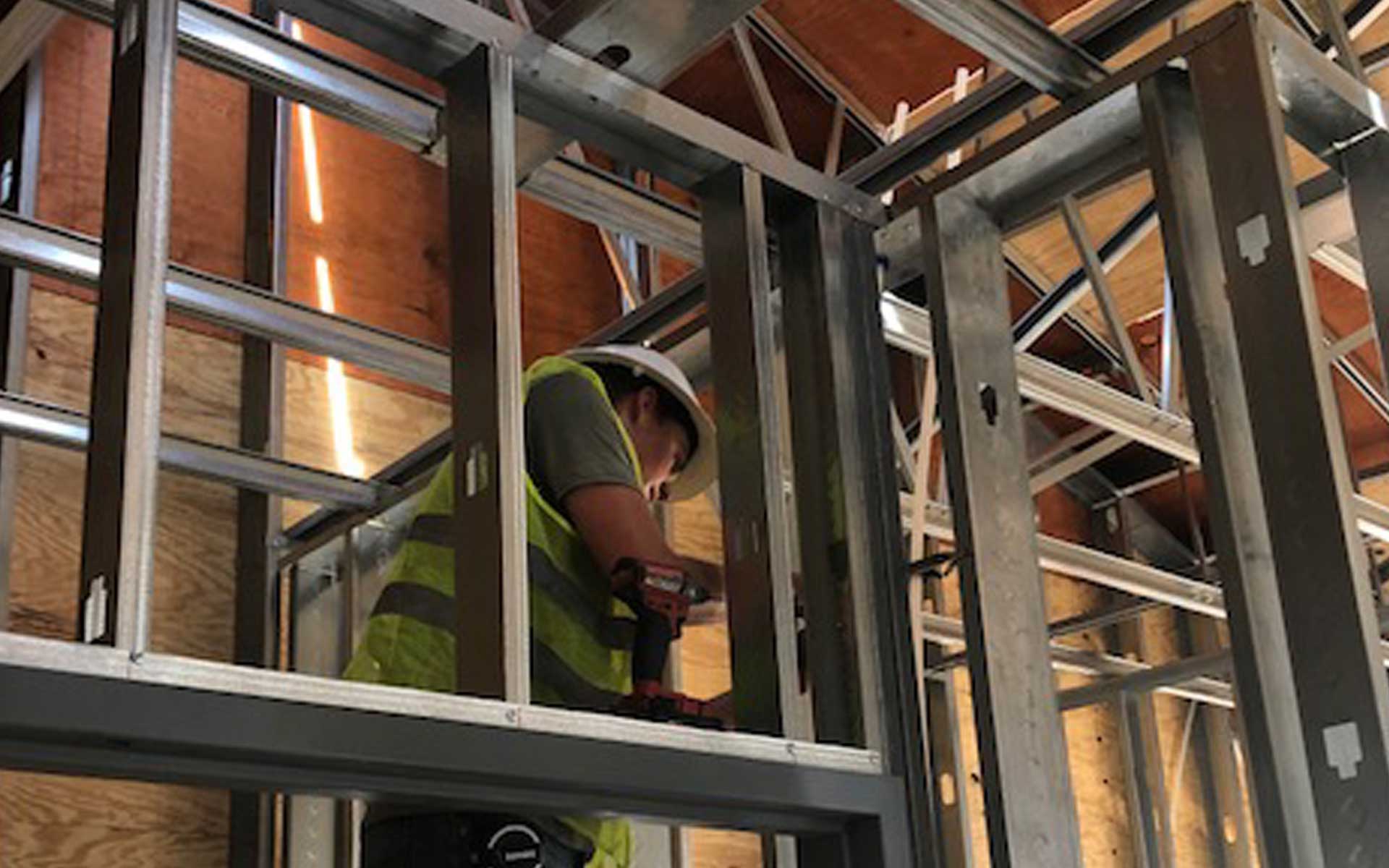 Plumber working in the attic