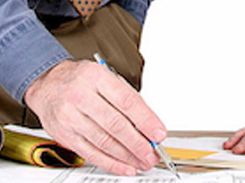 Blueprints showing a hand and pen
