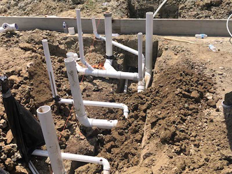 Water lines and sewer lines shown underrground